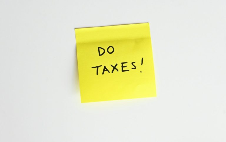 Sand texture with gentle ripples and subtle markings.